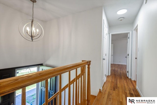 1511 Lorraine Ave, Bellevue, NE 68005 - hallway with an upstairs landing, wood finished floors, and a chandelier