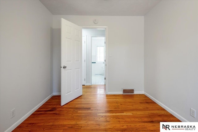 1511 Lorraine Ave, Bellevue, NE 68005 - empty room featuring light wood-type flooring, baseboards, and a smoke detector