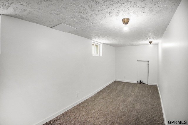 4315 N 39th St, Omaha, NE 68111 - below grade area with carpet floors, baseboards, and a textured ceiling