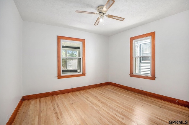 4315 N 39th St, Omaha, NE 68111 - unfurnished room with light wood-type flooring, baseboards, a ceiling fan, and a textured ceiling