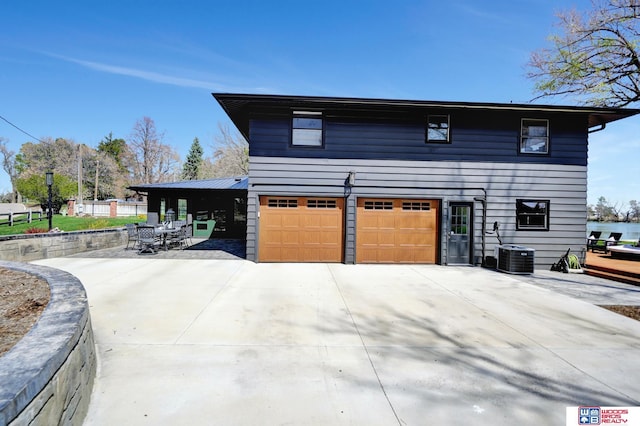 209 N Maloney Dr, North Platte, NE 69101 - view of side of property with driveway and an attached garage
