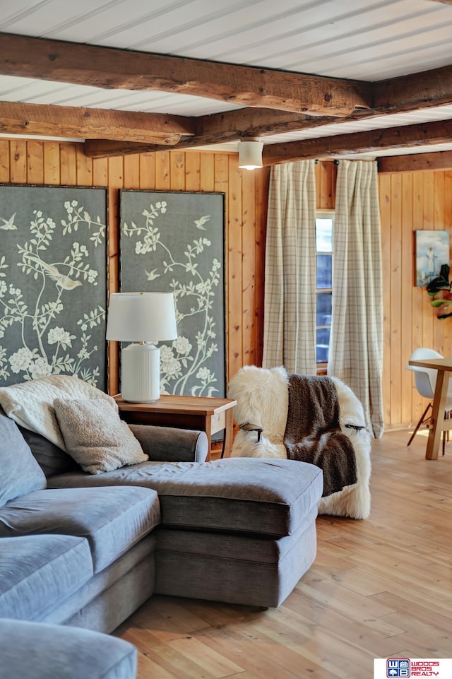 209 N Maloney Dr, North Platte, NE 69101 - living room with wood walls, beam ceiling, and hardwood / wood-style floors