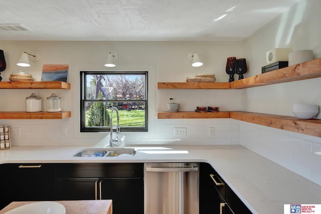 209 N Maloney Dr, North Platte, NE 69101 - kitchen featuring open shelves, dishwasher, decorative backsplash, and dark cabinets