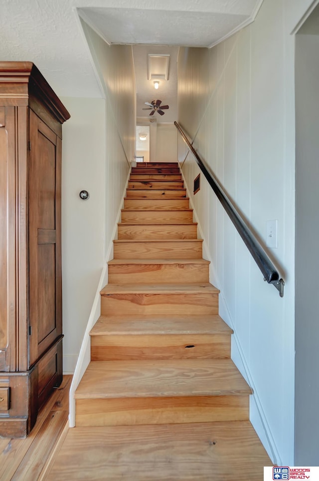 209 N Maloney Dr, North Platte, NE 69101 - stairs featuring wood finished floors and a ceiling fan