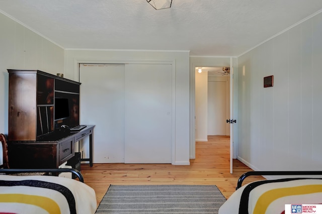 209 N Maloney Dr, North Platte, NE 69101 - bedroom with hardwood / wood-style flooring, ornamental molding, and a closet