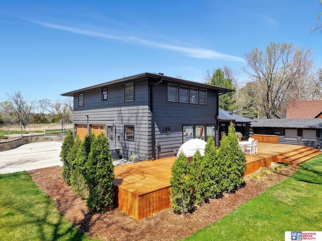 209 N Maloney Dr, North Platte, NE 69101 - view of property exterior with a deck and concrete driveway