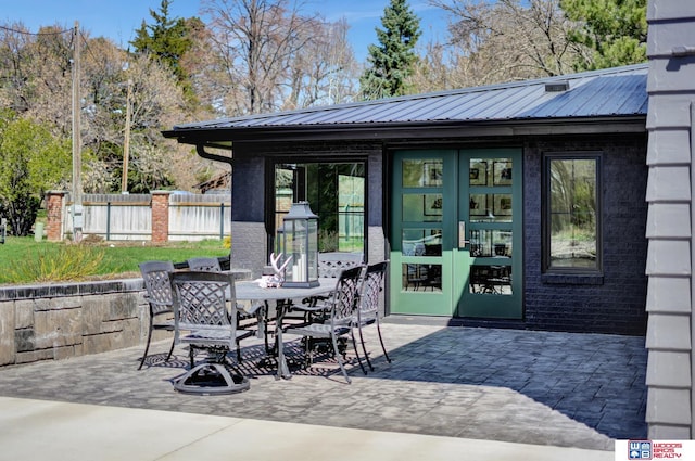 209 N Maloney Dr, North Platte, NE 69101 - view of patio / terrace with french doors and outdoor dining space