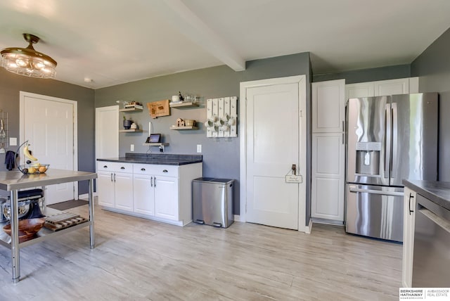 4332 Vinton St, Omaha, NE 68105 - kitchen with appliances with stainless steel finishes, dark countertops, open shelves, white cabinets, and light wood-style floors
