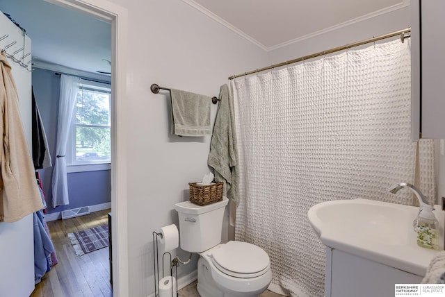 4332 Vinton St, Omaha, NE 68105 - bathroom with vanity, toilet, ornamental molding, wood finished floors, and baseboards