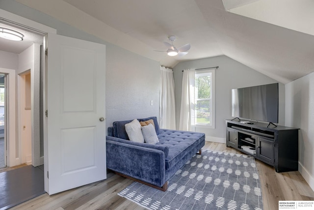 4332 Vinton St, Omaha, NE 68105 - sitting room featuring light wood-style floors, ceiling fan, vaulted ceiling, and baseboards