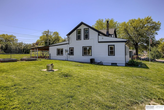 4332 Vinton St, Omaha, NE 68105 - back of house featuring a yard and a chimney
