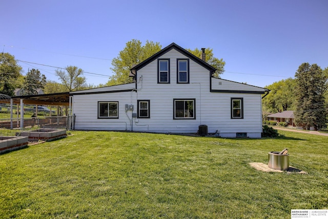 4332 Vinton St, Omaha, NE 68105 - rear view of house featuring a vegetable garden and central AC unit