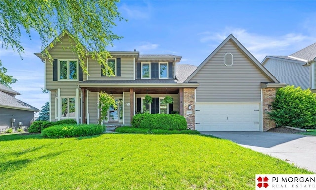 5517 S 174th Ave, Omaha, NE 68135 - traditional home with concrete driveway, a front lawn, and brick siding