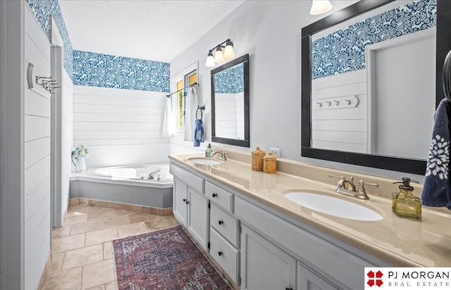 5517 S 174th Ave, Omaha, NE 68135 - full bathroom featuring double vanity, a garden tub, and tile patterned flooring