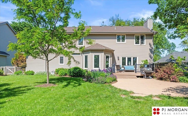 5517 S 174th Ave, Omaha, NE 68135 - rear view of house featuring a chimney and a wooden deck