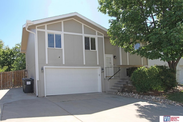 1912 SW 25th St, Lincoln, NE 68522 - view of front facade with a garage and driveway