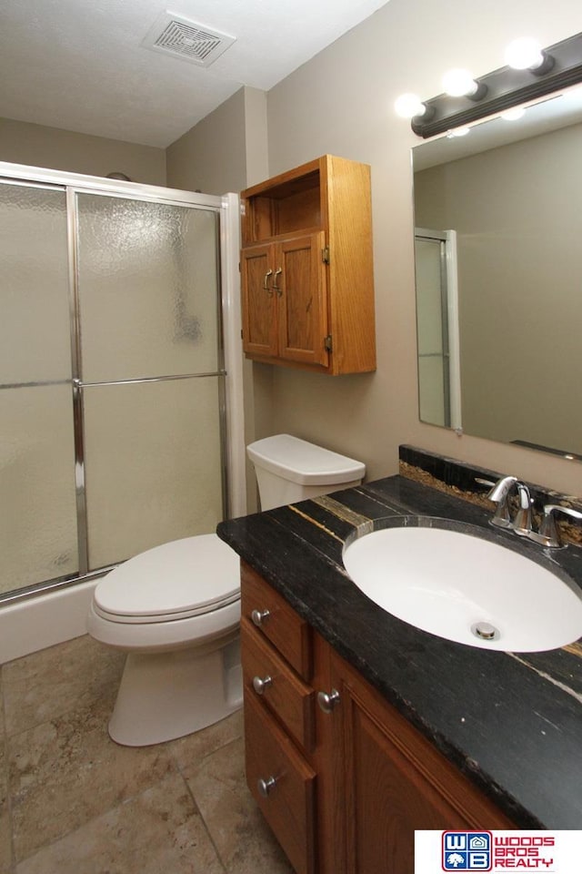 1912 SW 25th St, Lincoln, NE 68522 - full bath featuring vanity, a stall shower, and toilet