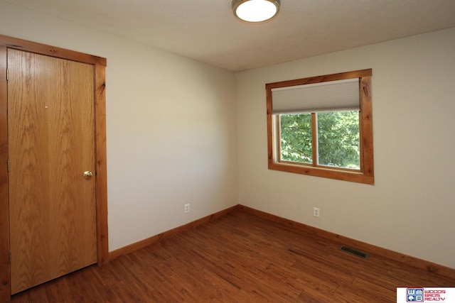 1912 SW 25th St, Lincoln, NE 68522 - spare room with wood finished floors and baseboards