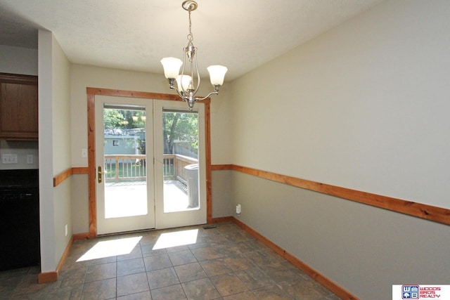 1912 SW 25th St, Lincoln, NE 68522 - doorway with french doors, baseboards, and a chandelier