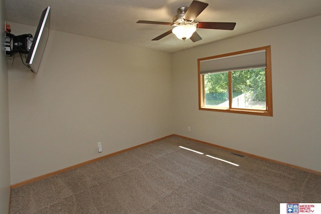 1912 SW 25th St, Lincoln, NE 68522 - unfurnished room featuring a ceiling fan, carpet floors, and baseboards