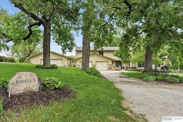 2564 County Road 12, Fremont, NE 68025 - view of front facade featuring a front lawn, driveway, and an attached garage