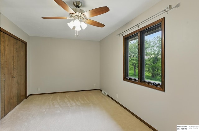 2564 County Road 12, Fremont, NE 68025 - unfurnished bedroom with light colored carpet, baseboards, and a ceiling fan