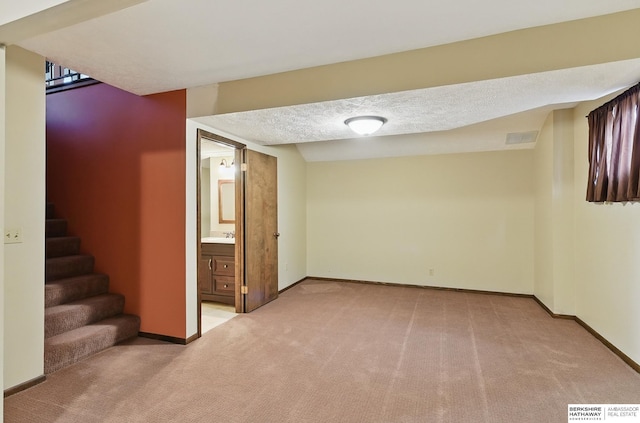 2564 County Road 12, Fremont, NE 68025 - finished basement featuring light carpet, baseboards, and stairway