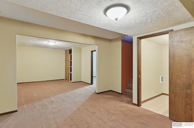 2564 County Road 12, Fremont, NE 68025 - carpeted empty room featuring a textured ceiling, stairway, and baseboards