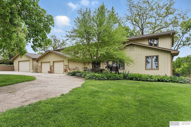 2564 County Road 12, Fremont, NE 68025 - mid-century modern home featuring a garage, driveway, and a front lawn