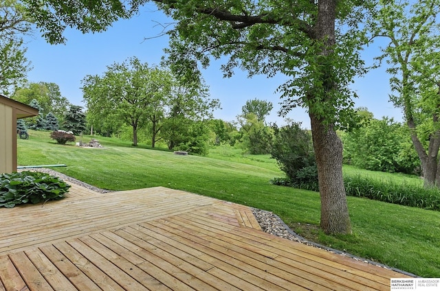 2564 County Road 12, Fremont, NE 68025 - wooden deck featuring a yard and view of wooded area