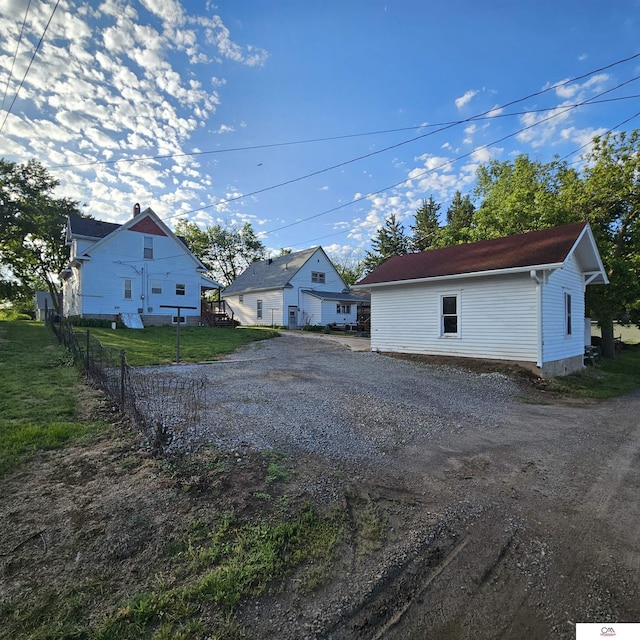 1119 H St, Fairbury, NE 68352 - view of yard featuring driveway