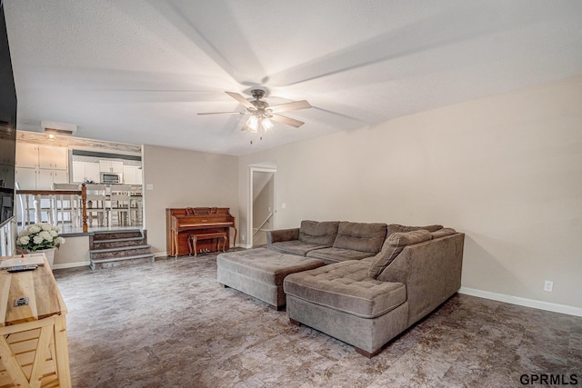 13055 Brookside Dr, Bellevue, NE 68123 - living room with a ceiling fan and baseboards