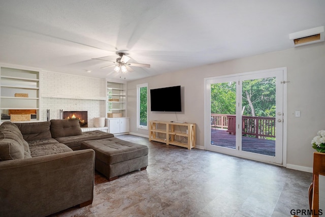 13055 Brookside Dr, Bellevue, NE 68123 - living room featuring a ceiling fan, plenty of natural light, baseboards, and built in features