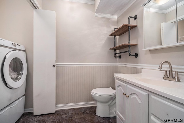 13055 Brookside Dr, Bellevue, NE 68123 - bathroom featuring washer / clothes dryer, crown molding, a wainscoted wall, vanity, and toilet