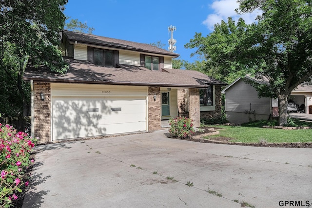 13055 Brookside Dr, Bellevue, NE 68123 - view of front of home featuring brick siding and driveway