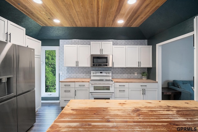 13055 Brookside Dr, Bellevue, NE 68123 - kitchen with butcher block countertops, stainless steel appliances, wooden ceiling, tasteful backsplash, and dark wood-style flooring