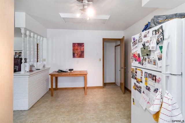 2206 N 56th St, Omaha, NE 68104 - kitchen featuring freestanding refrigerator and baseboards