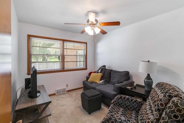 2206 N 56th St, Omaha, NE 68104 - carpeted living area featuring a ceiling fan and baseboards