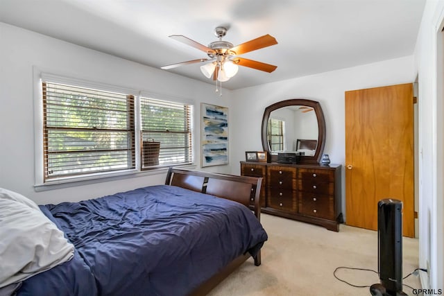 2206 N 56th St, Omaha, NE 68104 - bedroom with light colored carpet and a ceiling fan