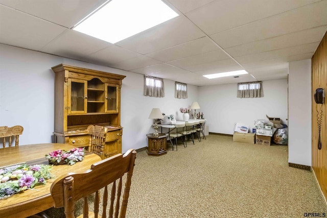 2206 N 56th St, Omaha, NE 68104 - dining space featuring carpet, baseboards, and a paneled ceiling