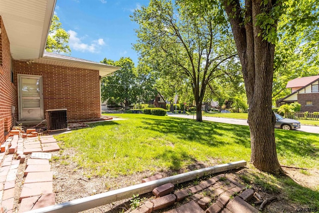 2206 N 56th St, Omaha, NE 68104 - view of green lawn featuring central air condition unit