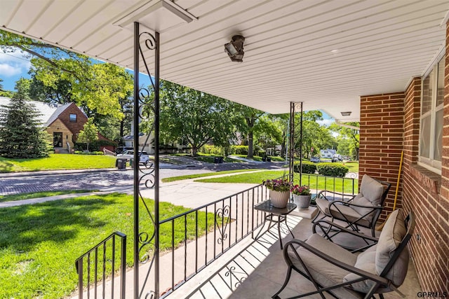 2206 N 56th St, Omaha, NE 68104 - porch featuring a lawn