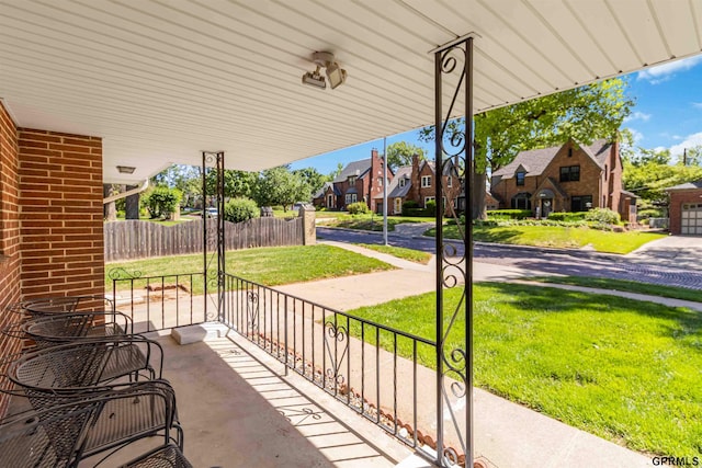 2206 N 56th St, Omaha, NE 68104 - porch with a residential view and a lawn