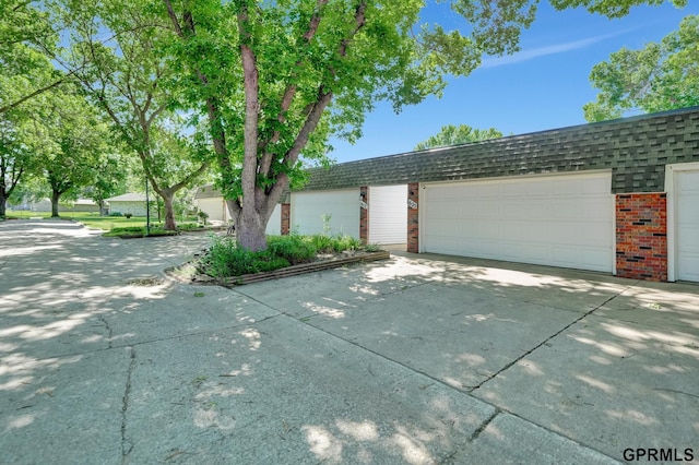 1625 Granada Ln, Lincoln, NE 68528 - view of front of property featuring brick siding and a garage