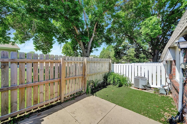 1625 Granada Ln, Lincoln, NE 68528 - fenced backyard featuring central air condition unit and a patio