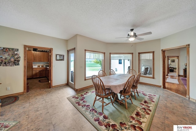 40798 US Highway 6, Cambridge, NE 69022 - dining space featuring a ceiling fan, a textured ceiling, baseboards, and light tile patterned floors