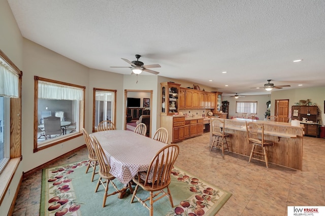 40798 US Highway 6, Cambridge, NE 69022 - dining room featuring a ceiling fan, a textured ceiling, recessed lighting, and light tile patterned flooring
