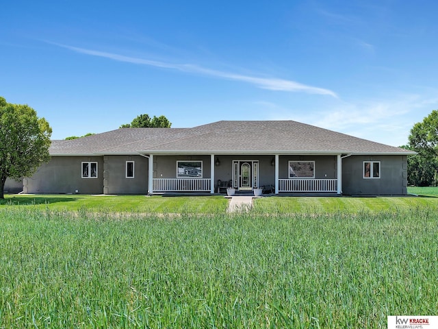 40798 US Highway 6, Cambridge, NE 69022 - view of front of property with covered porch, stucco siding, and a front yard