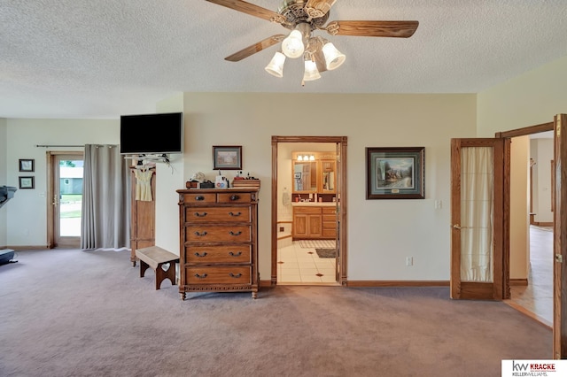 40798 US Highway 6, Cambridge, NE 69022 - bedroom with a textured ceiling, carpet, access to outside, baseboards, and ensuite bathroom