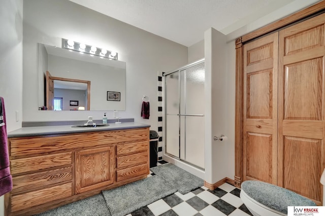 40798 US Highway 6, Cambridge, NE 69022 - bathroom featuring tile patterned floors, a stall shower, vanity, and toilet